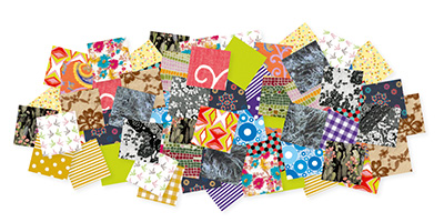 Eine Collage aus verschiedenen bunten Papierstücken von Décopatch mit unterschiedlichen Mustern, darunter Blumen, Streifen und geometrische Designs. Die Muster sind zufällig übereinander geschichtet, wodurch ein lebendiges und vielseitiges Bild entsteht.